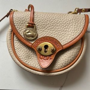 Dooney & Bourke Vintage Mini Cavalry Crossbody cream. authentic.